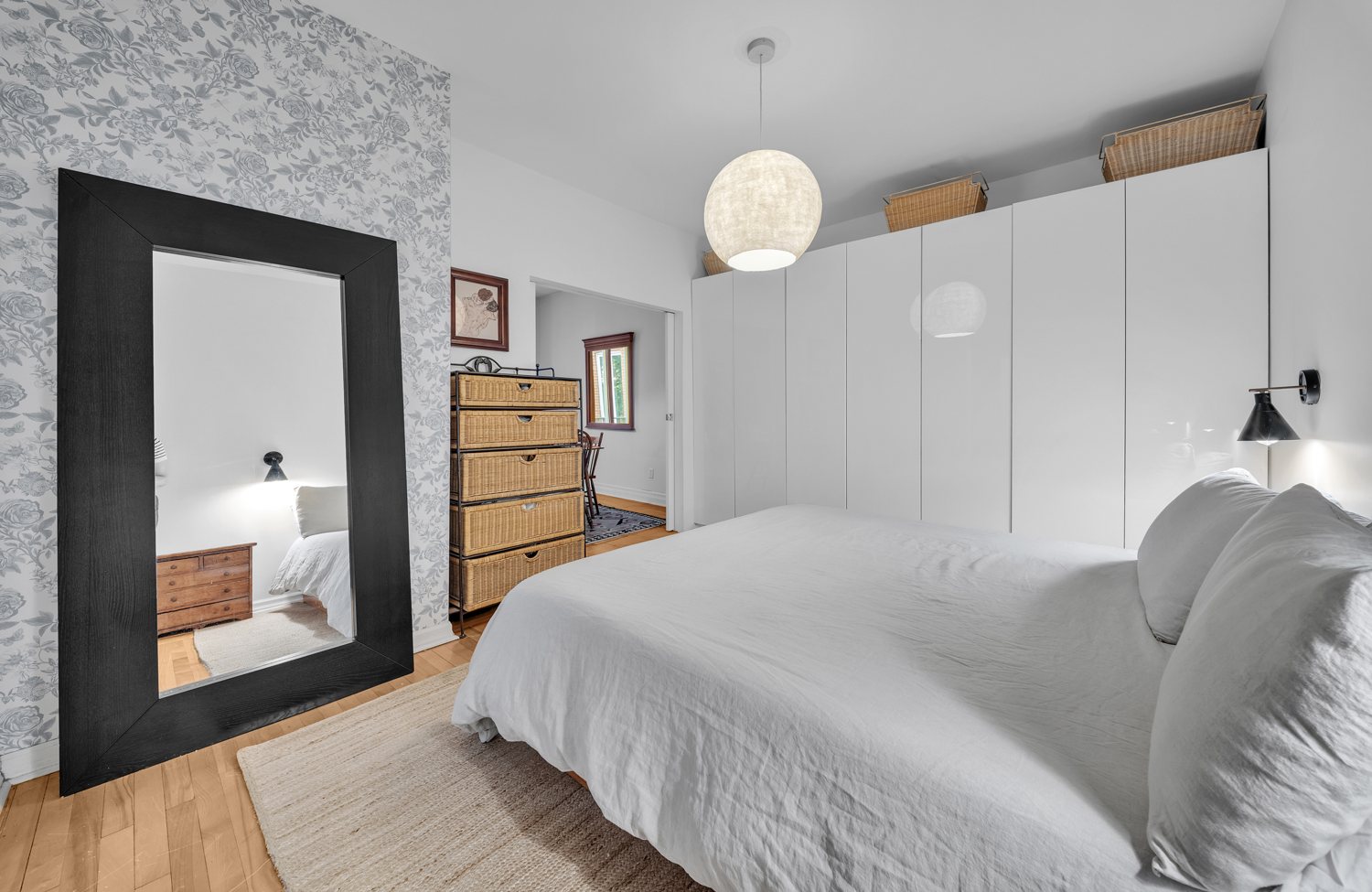 Bedroom with integrated storage and wallpaper detail