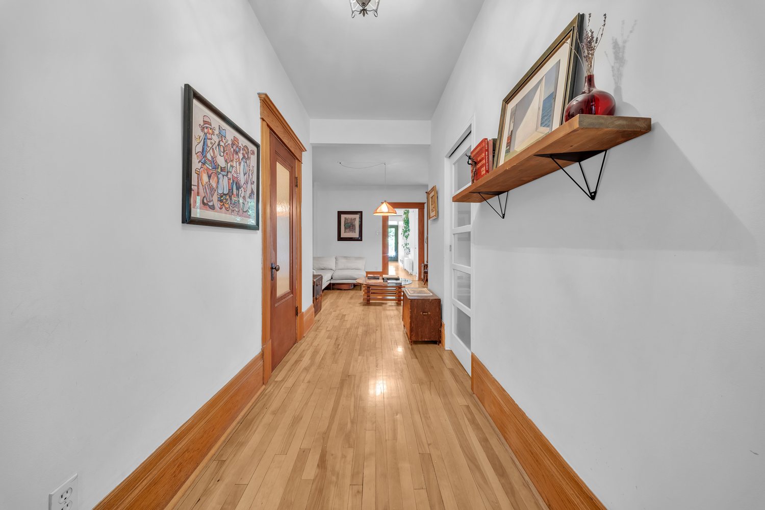 Long interior hall with restored wood trim