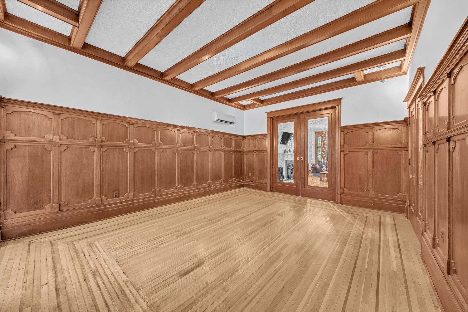 Panelled room with beamed ceiling