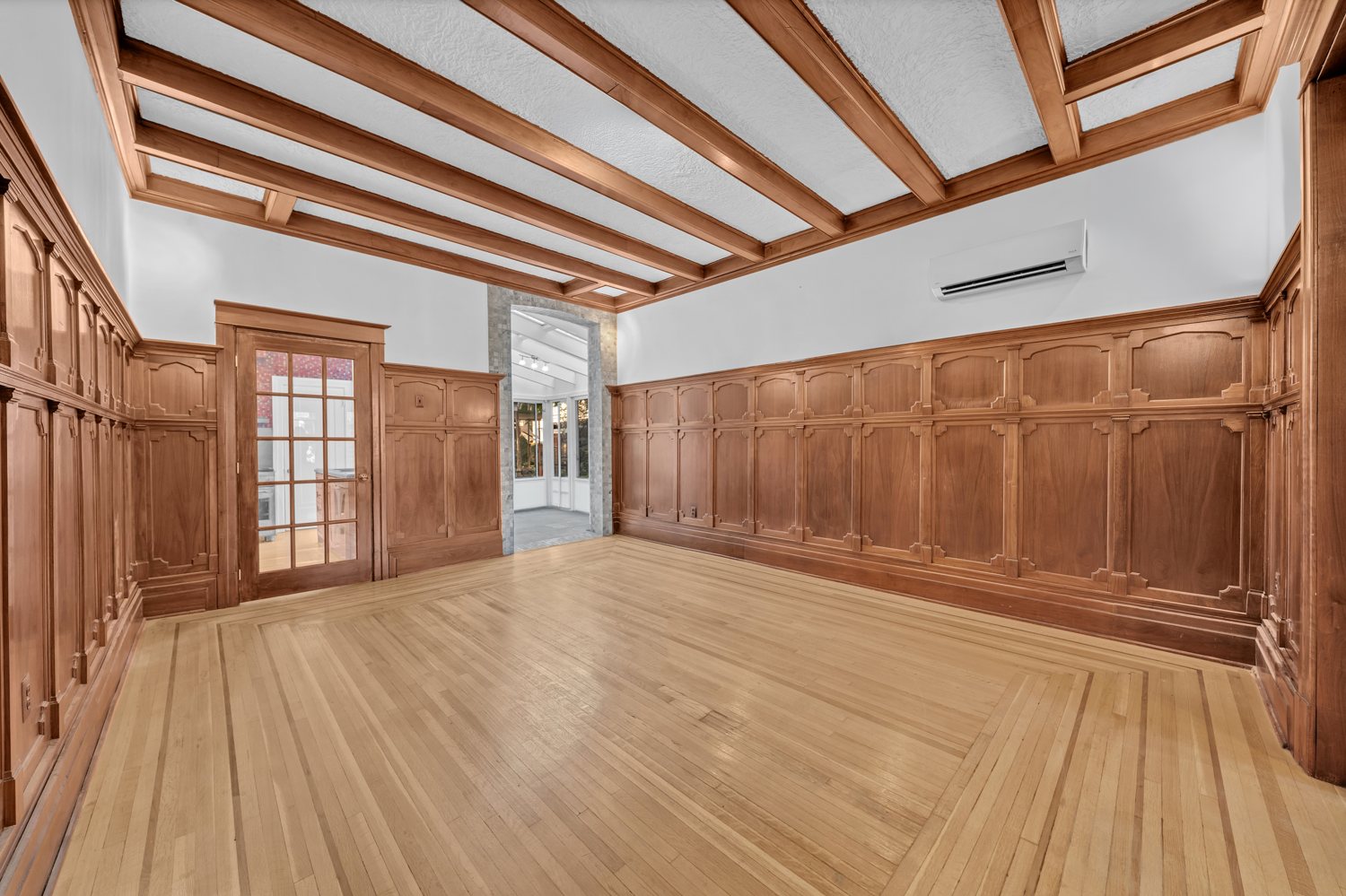 Expansive room with original millwork