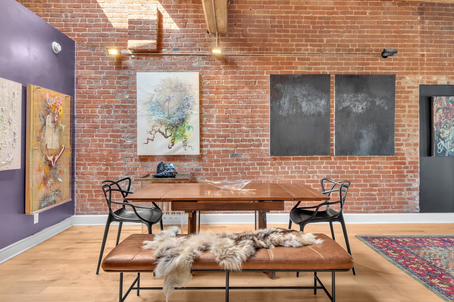 Dining area framed by exposed brick and timber